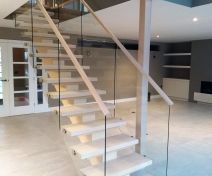 Modern Oiled Maple Staircase with Glass Banisters and Central String 
