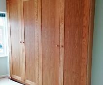 Polished Oak Wardrobe with Shaker Style Doors and Side Panels