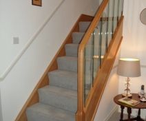 Polished Oak Staircase with Thin Glass Banisters