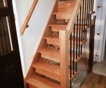 Polished Oak Staircase with Suspended Open Steps on Black Metallic Spindles