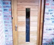 Manufacturing and Fitting of One Modern Style External Oak Door with Horizontal Boards and One Thin Vertical Double Glazed Unit