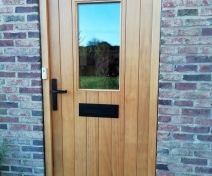 External Double Glazed Accoya Door and Frame with Vertical Boards Finished with 1 coat of Teknos Aquaprimer and 2 top coats of Teknos Aquatop