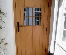 Double glazed Accoya External Door with Vertical Boards Finished with Teknos Aquatop